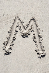 Sand beach alphabet: letter M