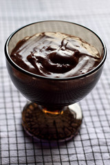 Chocolate pudding in black bowl