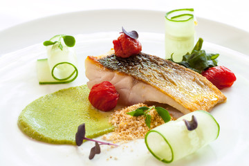Grilled seabass with cherry tomatoes and avocado.