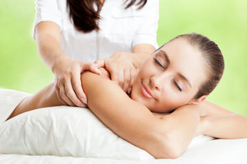 Obraz na płótnie Canvas Beautiful woman at massage procedure