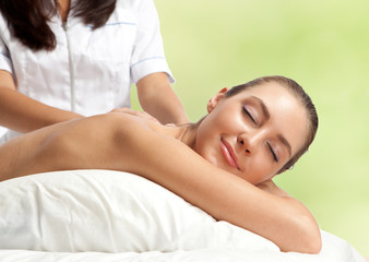 Fototapeta na wymiar Beautiful woman at massage procedure