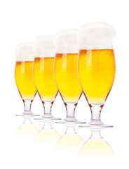 Frosty glass of light beer isolated