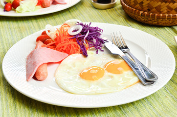 breakfast with fried eggs and salad