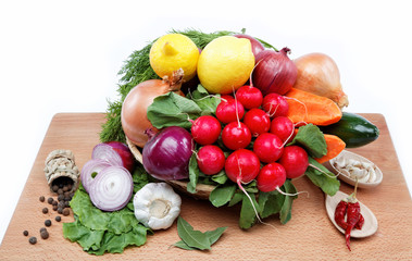 Healthy food. Fresh vegetables and fruits on a wooden board.