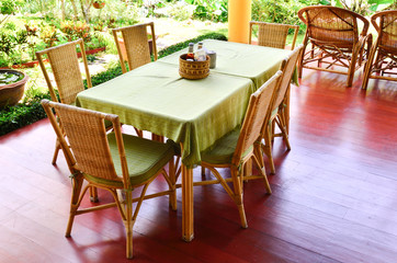 Fototapeta na wymiar Dining table with chairs in the garden