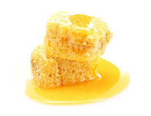 golden honeycombs with honey isolated on white.