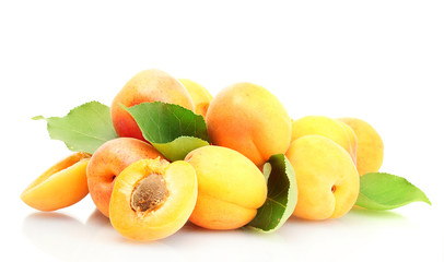 ripe apricots with green leaves isolated on white