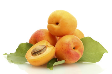ripe sweet apricots with green leaves isolated on white