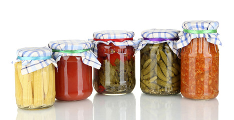 Jars with canned vegetables isolated on white