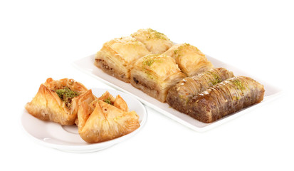 Sweet baklava on plates isolated on white