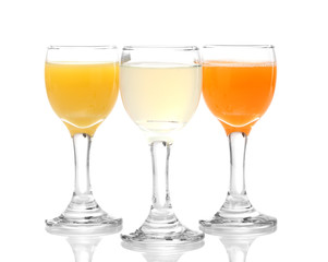 Tropical juices in glasses isolated on white