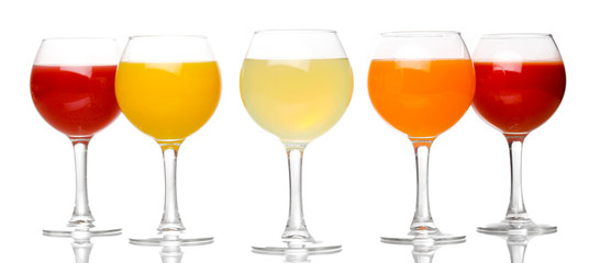 Tropical juices in glasses isolated on white
