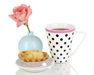 sweet cake with cup of tea isolated on white