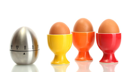egg timer and egg in color stand isolated on white