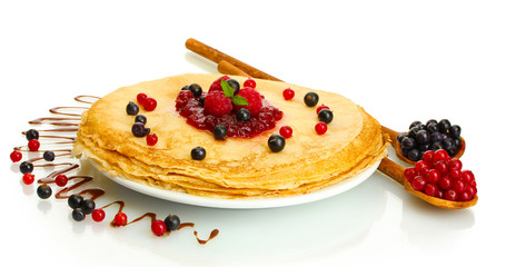 Delicious pancakes with berries and jam
