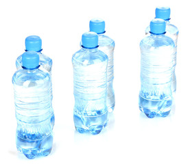 plastic bottles of water isolated on white