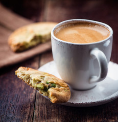 Cup of espresso and pistachio cookie