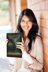 female university student holding tablet computer