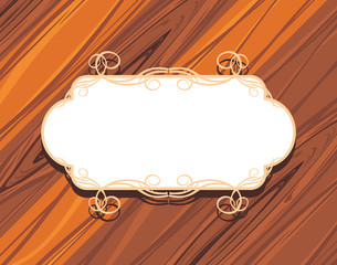 Decorative frame on the wooden background