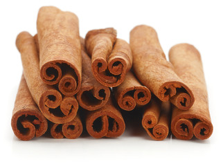 Cinnamon sticks spice isolated over white background.