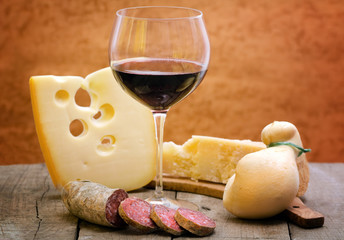 red wine with cheese selection and salami