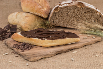 Chocolate Creme on a bun (rustic background)