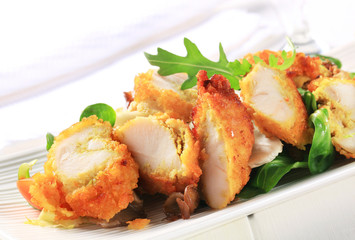 Breaded chicken breast with salad greens