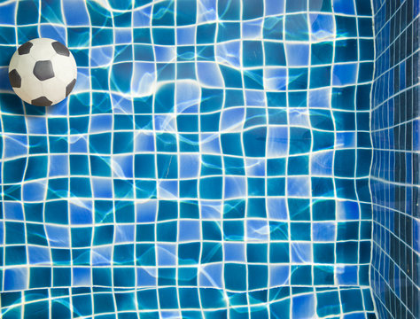 Plasticine football and Blue water in Swimming pool
