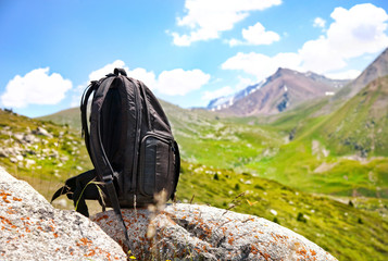 backpack in mountains