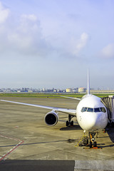 Photo of an airplane at the airport on the tarmac