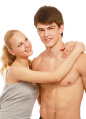 A young sportive couple, isolated on white background