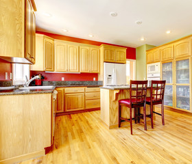 Yellow kitchen with island and yellow wood.