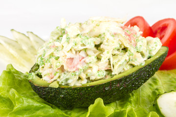 Crab meat salad with green caviar in avocado - japan cusine