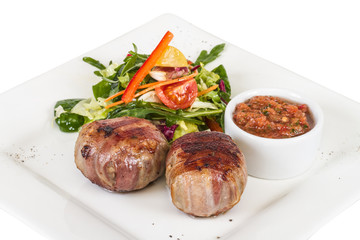 Grilled steak wrapped in bacon, with grilled vegetables, mashed