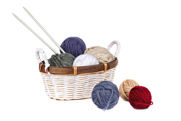 multi-colored balls of yarn in the basket