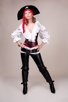 Beautiful woman in carnival costume. Pirate shape.