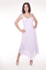 Naklejka premium Beautiful young woman wearing a sexy light .pink evening dress