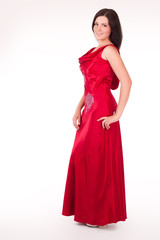 Beautiful young woman wearing a sexy red evening dress