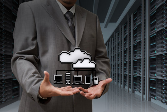 Businessman show cloud network icon on server room