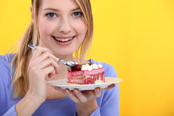 Woman eating strawberry cake