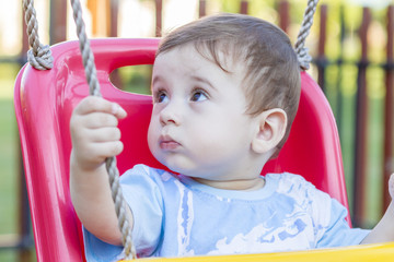 baby boy in swing