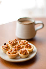 Cashew tart with cup of coffee