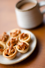 Cashew tart with cup of coffee