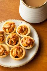 Cashew tart with cup of coffee