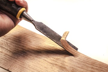 Carpenter working with chisel,isolated