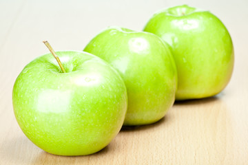 Three green apples