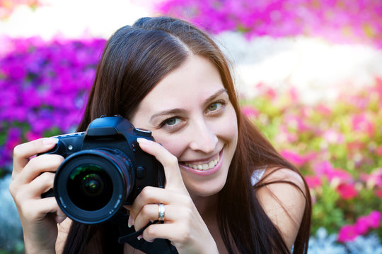 woman is taking pictures in the flower
