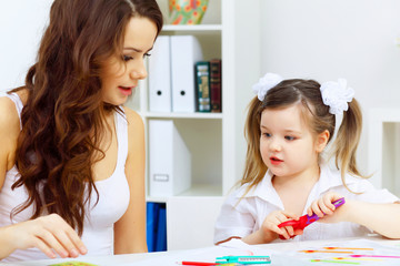 Mother and daughter studying