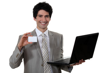 Man with laptop and calling card