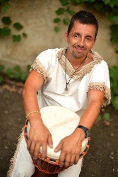 hispanic man with drum